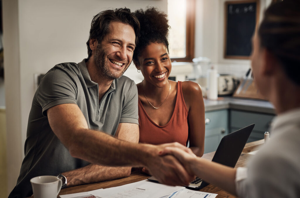 Cropped shot of a handsome middle aged man shaking hands with a financial advisor during a consultation at home